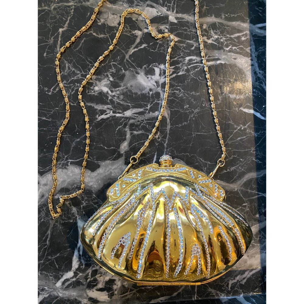 An Evening Metal Gold Clutch/Purse With a Strap.